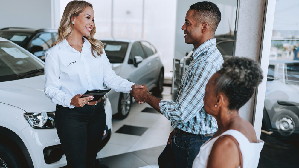 Used car buying guide handshake at dealership  auto buying tips, car purchase checklist, and lease vs buy car advice.